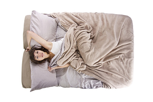 woman lying on mattress