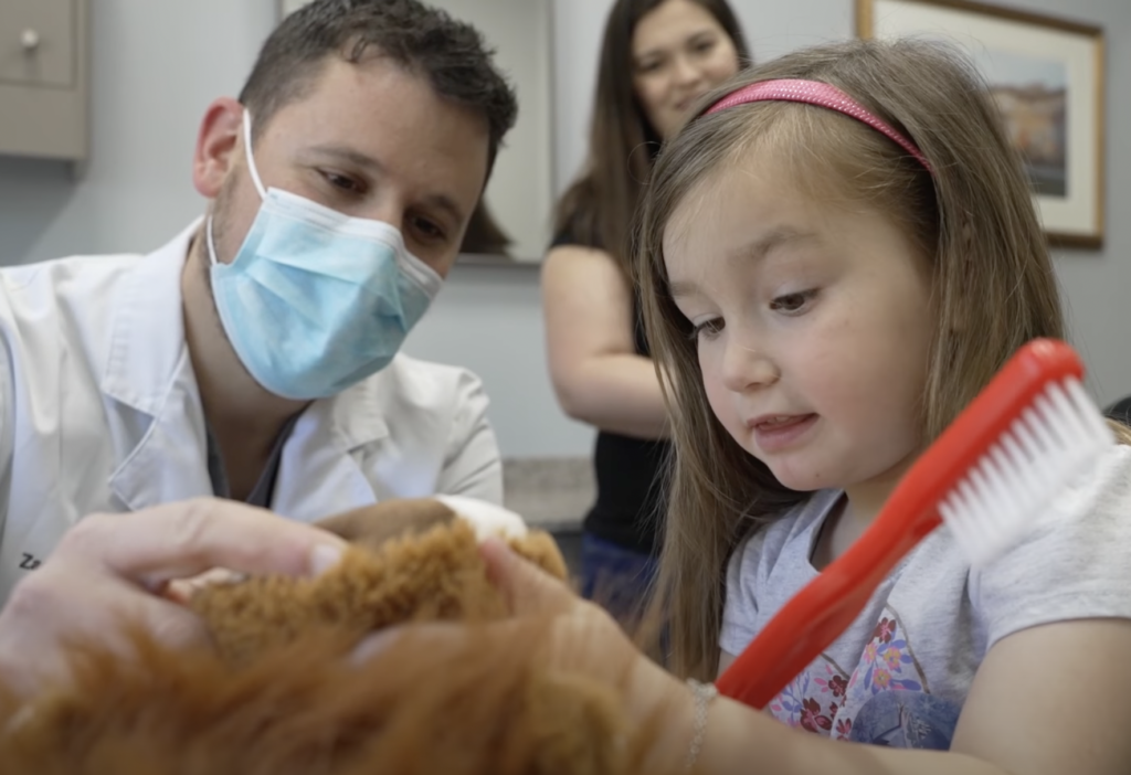 little girl and dentist